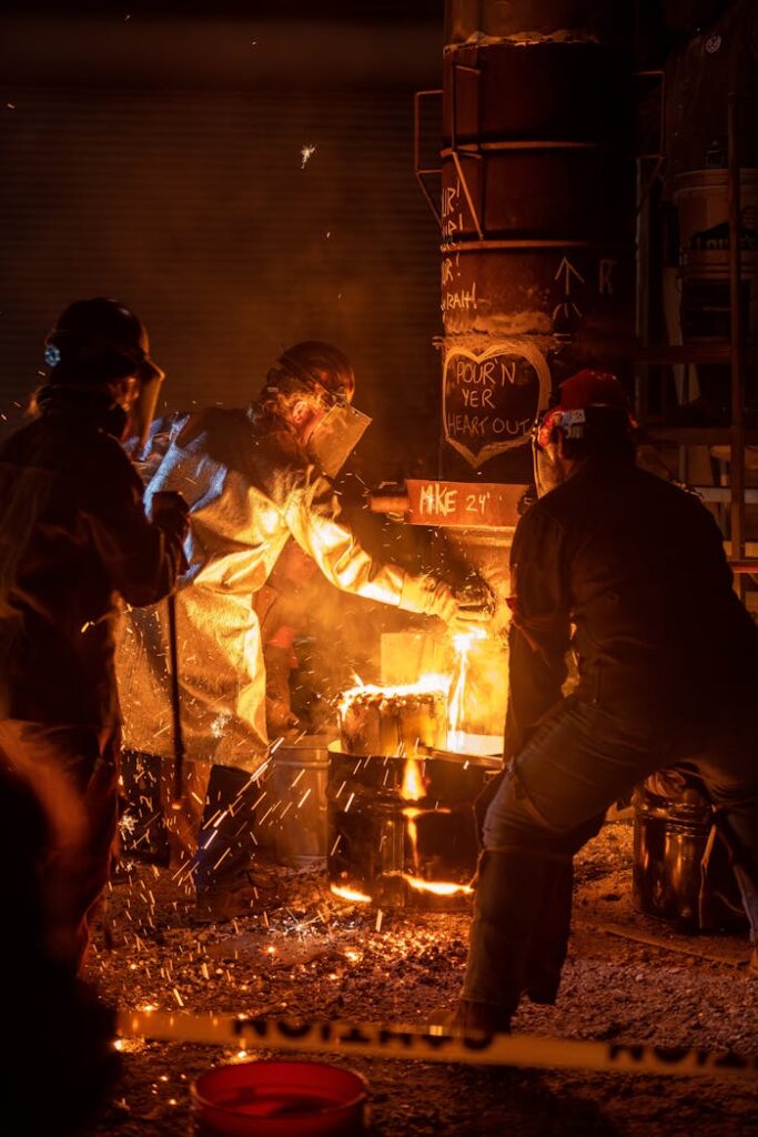 IDP casting metal ocmpany's workers is protective gear pour molten metal in our foundry